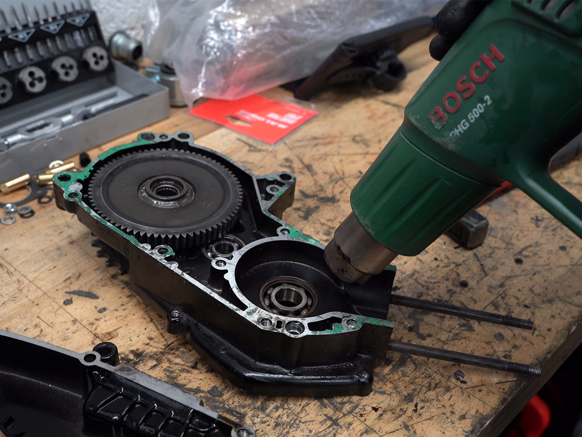 Applying controlled heat before bearing removal